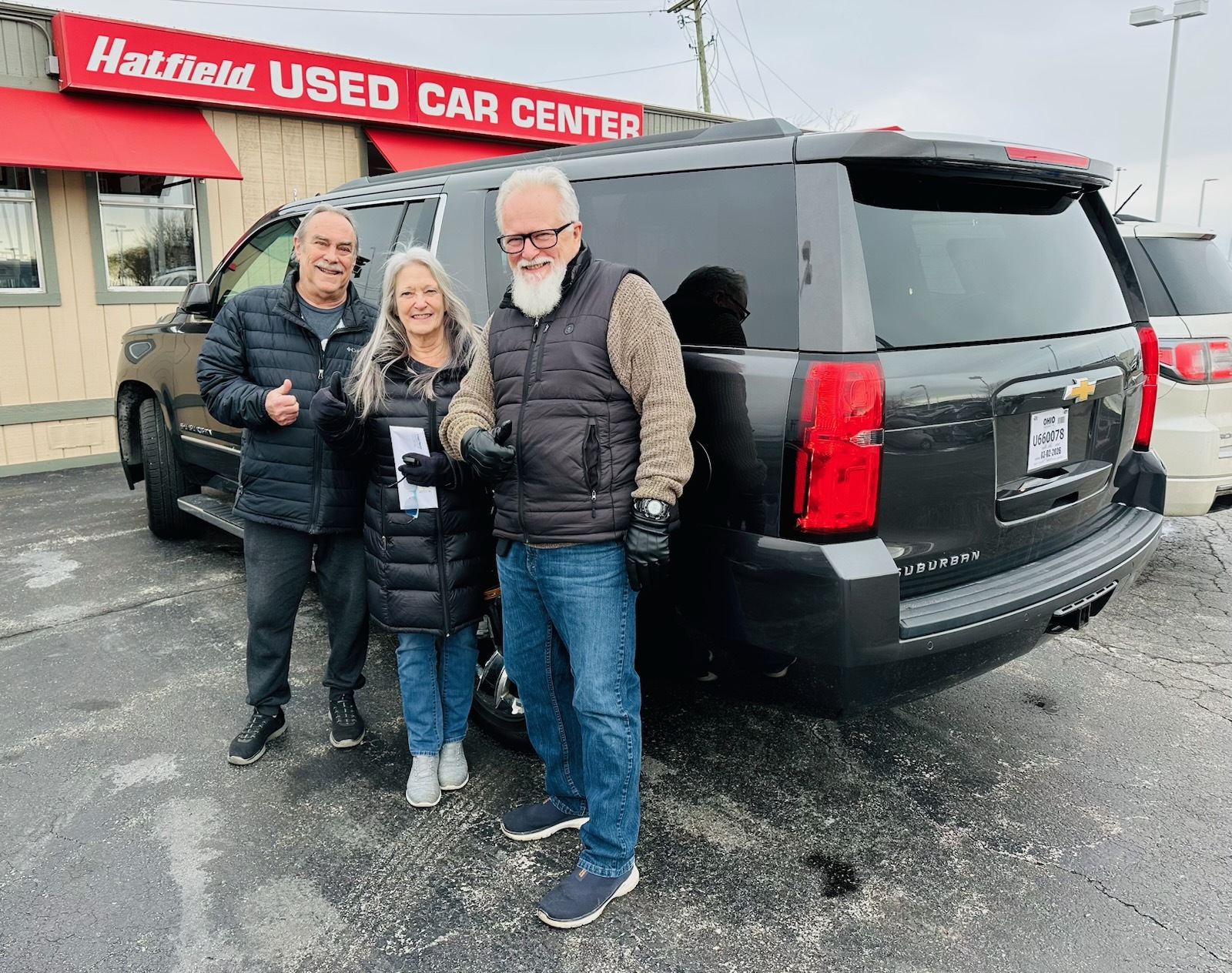 Phil and Robin's Suburban with Ron - Hatfield Used Car Center customer